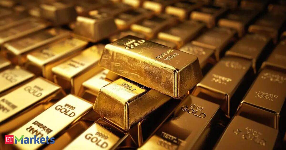 金条与黄金价格走势图,叠加美联储FOMC会议预期与中东地缘推升油价主题,背景为10年期美债收益率突破5%心理位